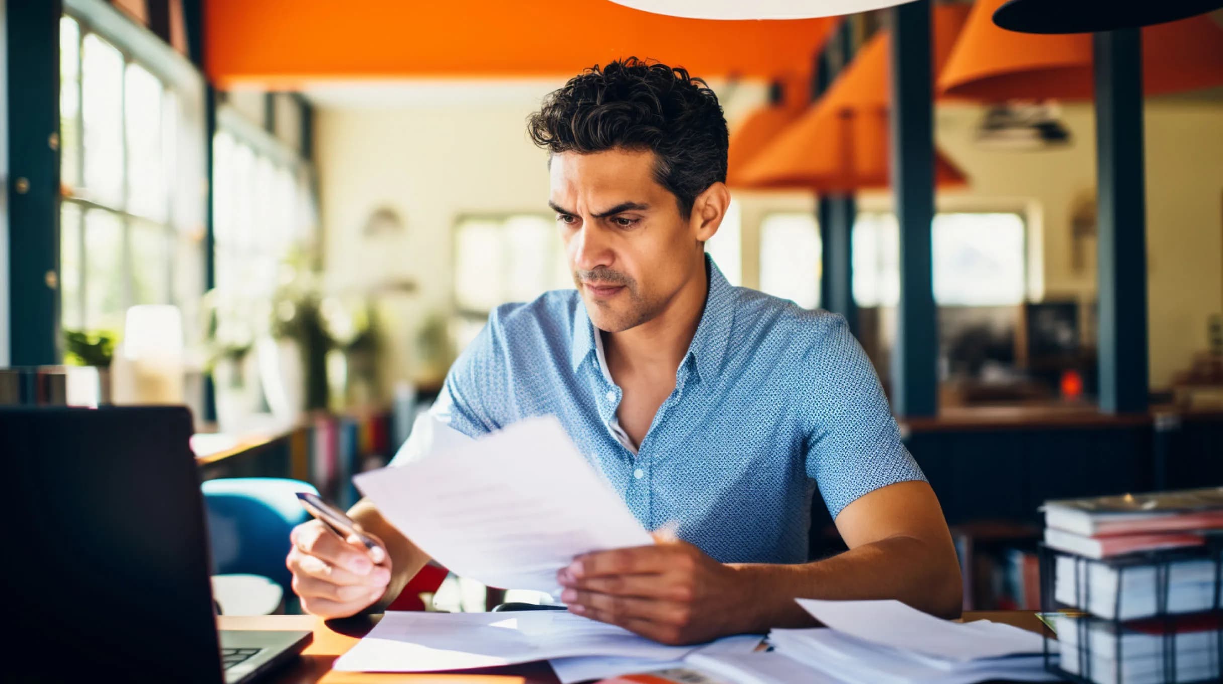 A man filling annual report