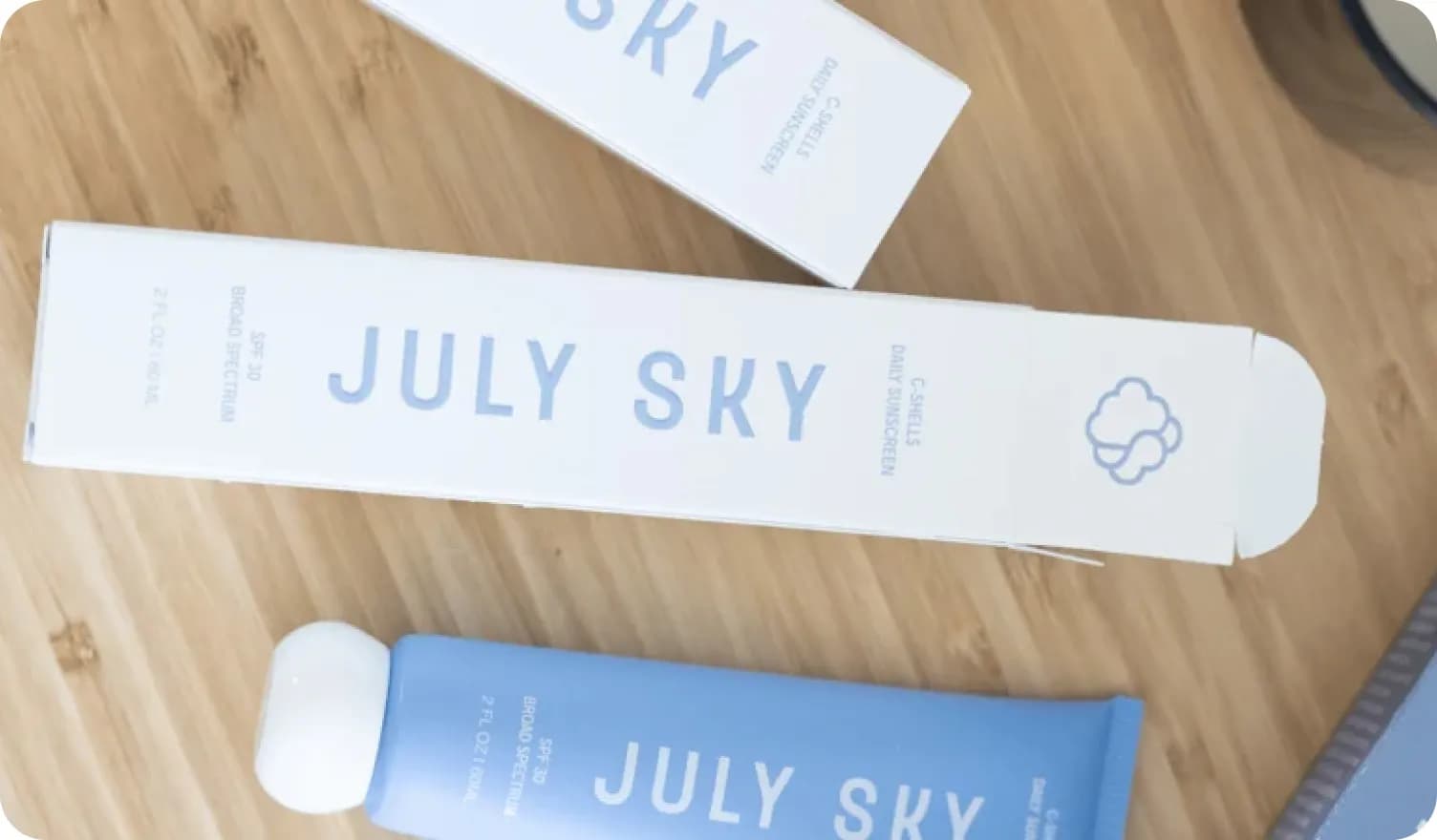 Products of July Sky lying on the table