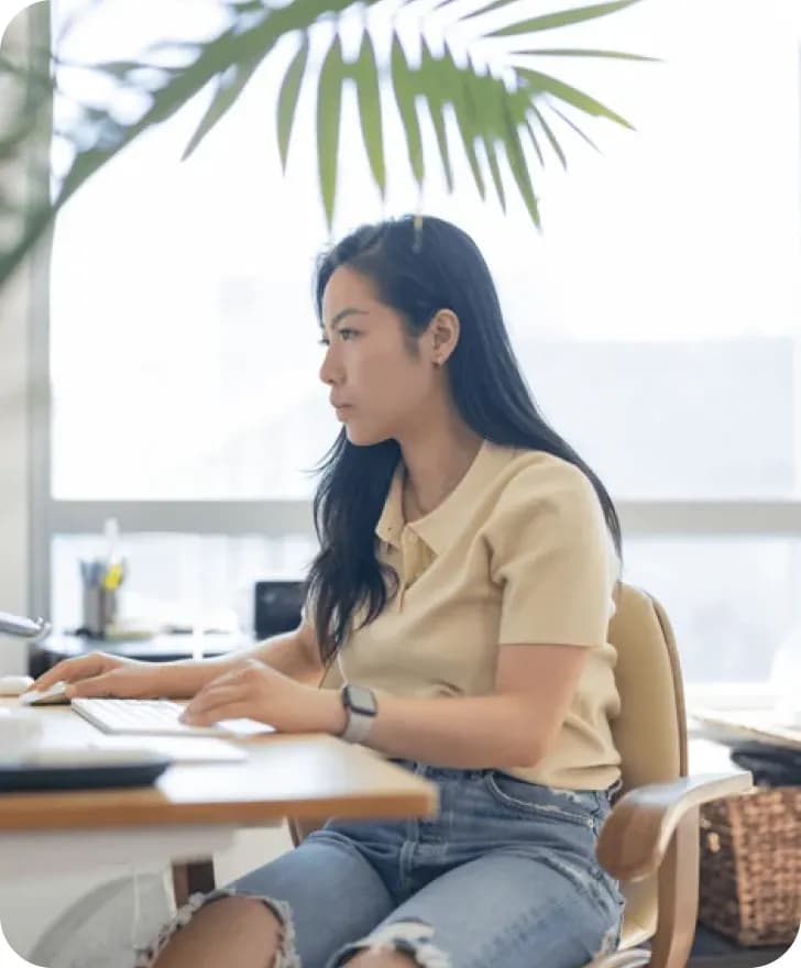 Aoxue Tang sitting at the desk.