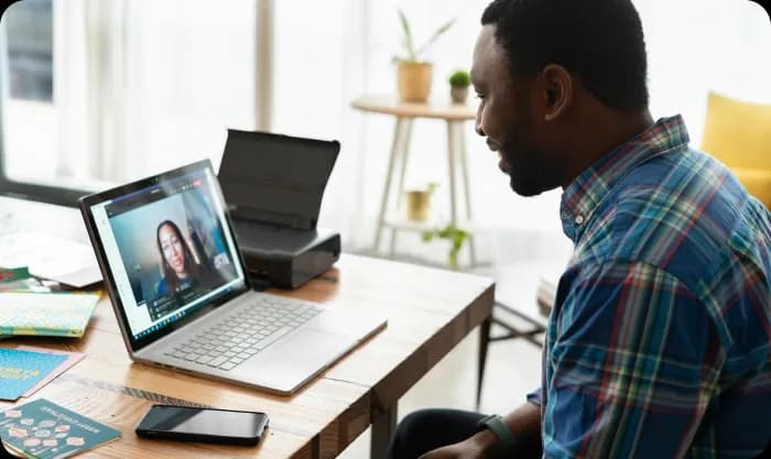man-in-blue-and-white-plaid-dress-shirt-using-macbook-pro