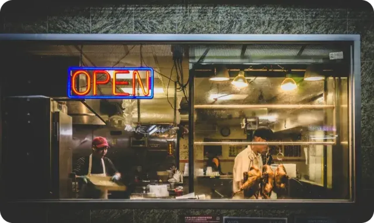 A restaurant front with a sign reading 