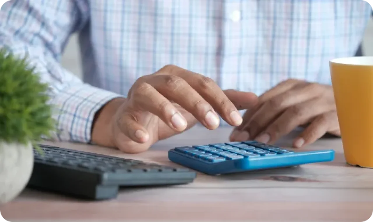 Man Using Calculator